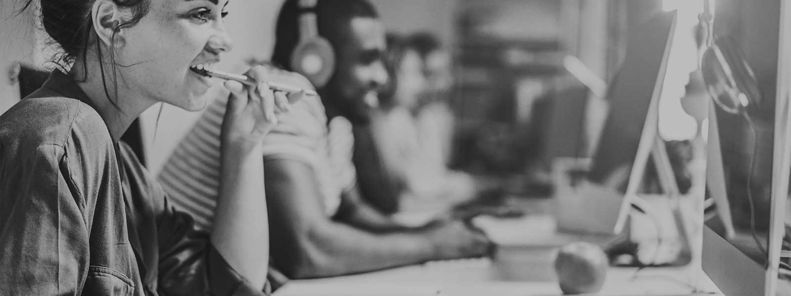 People working in an office sat at desks