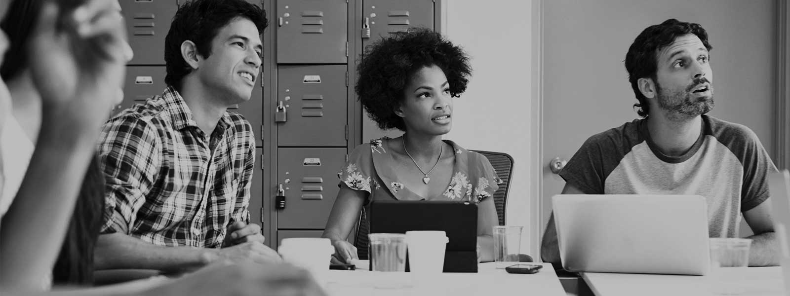 People in a classroom listening