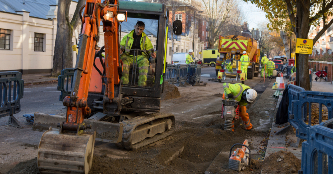 Workers doing road maintenance on a residential area. Credit: Shutterstock/Kauka Jarvi