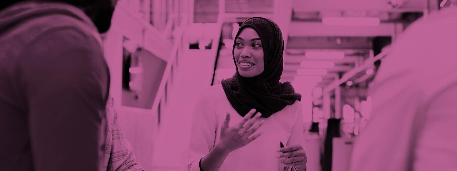 Woman chatting to colleagues