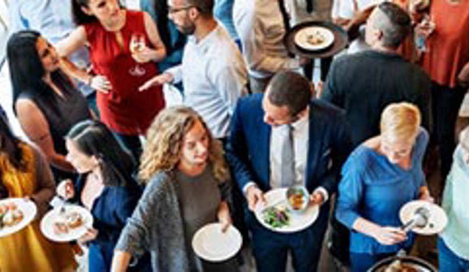 Delegates mingle while enjoying buffet style catering