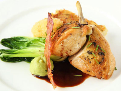 Seared chicken breast with rösti potato, leek puree, Parma ham crisp, pan fried bok choi and lemon thyme sauce