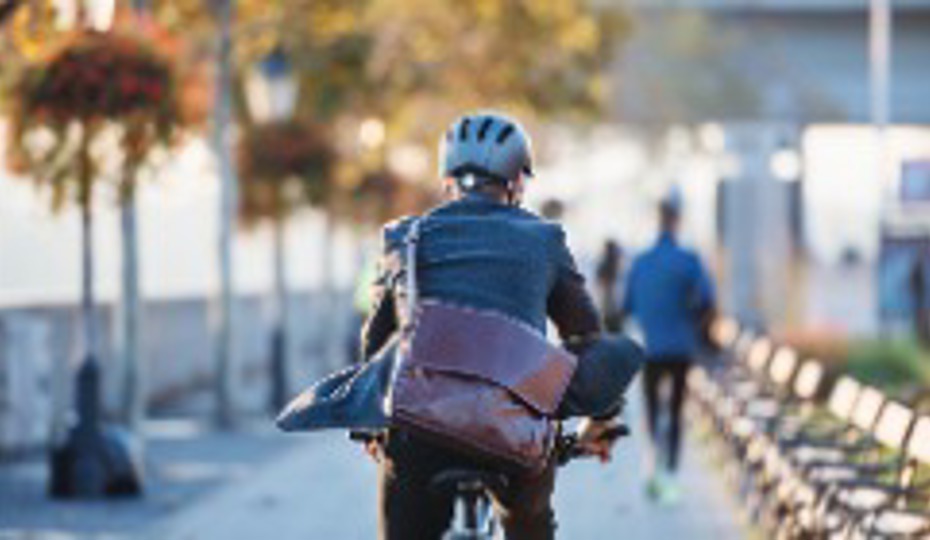 Businessman commuter on an electric bicycle