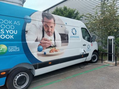 One of Johnsons Stalbridge's electric vehicles charging outside the Southall laundry facility