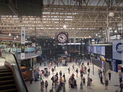 View from above of commuters walking through London Waterloo Station