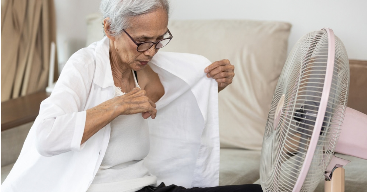 Person using a fan to cool down