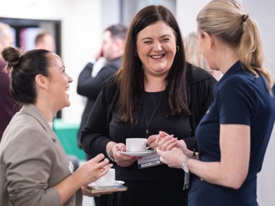 Delegates enjoying refreshments and networking in the Ozone room