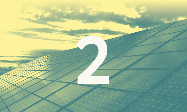 A background image showing solar panels, with a large number 2 overlaid on top