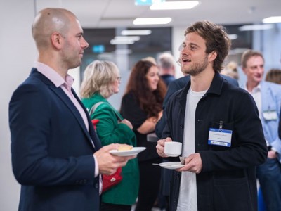 Delegates enjoying refreshments and networking in the Ozone room