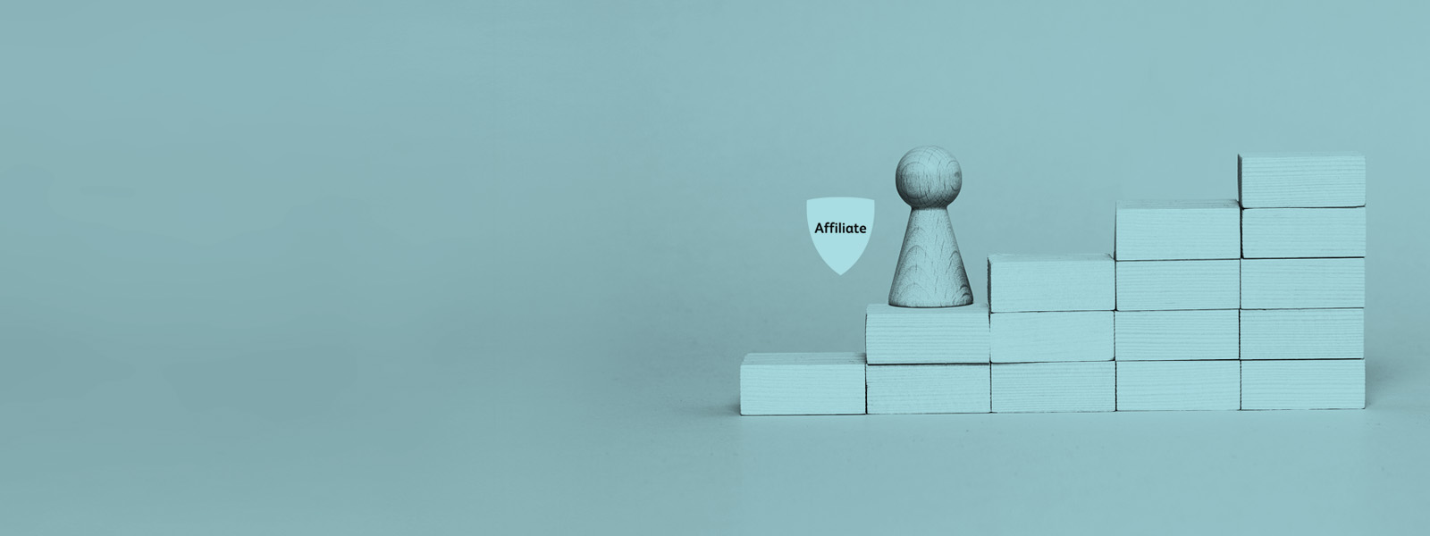 Affiliate badge with a wooden pawn on the second step of a tower of blocks