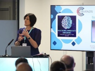 Speaker delivers session from podium at The Healthcare Connectivity Conference