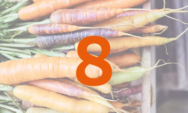 A bunch of carrots with the number 8 overlaid on top