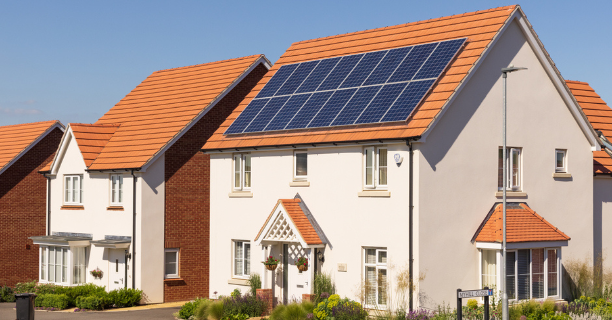 Detached new build home with solar panels on the roof